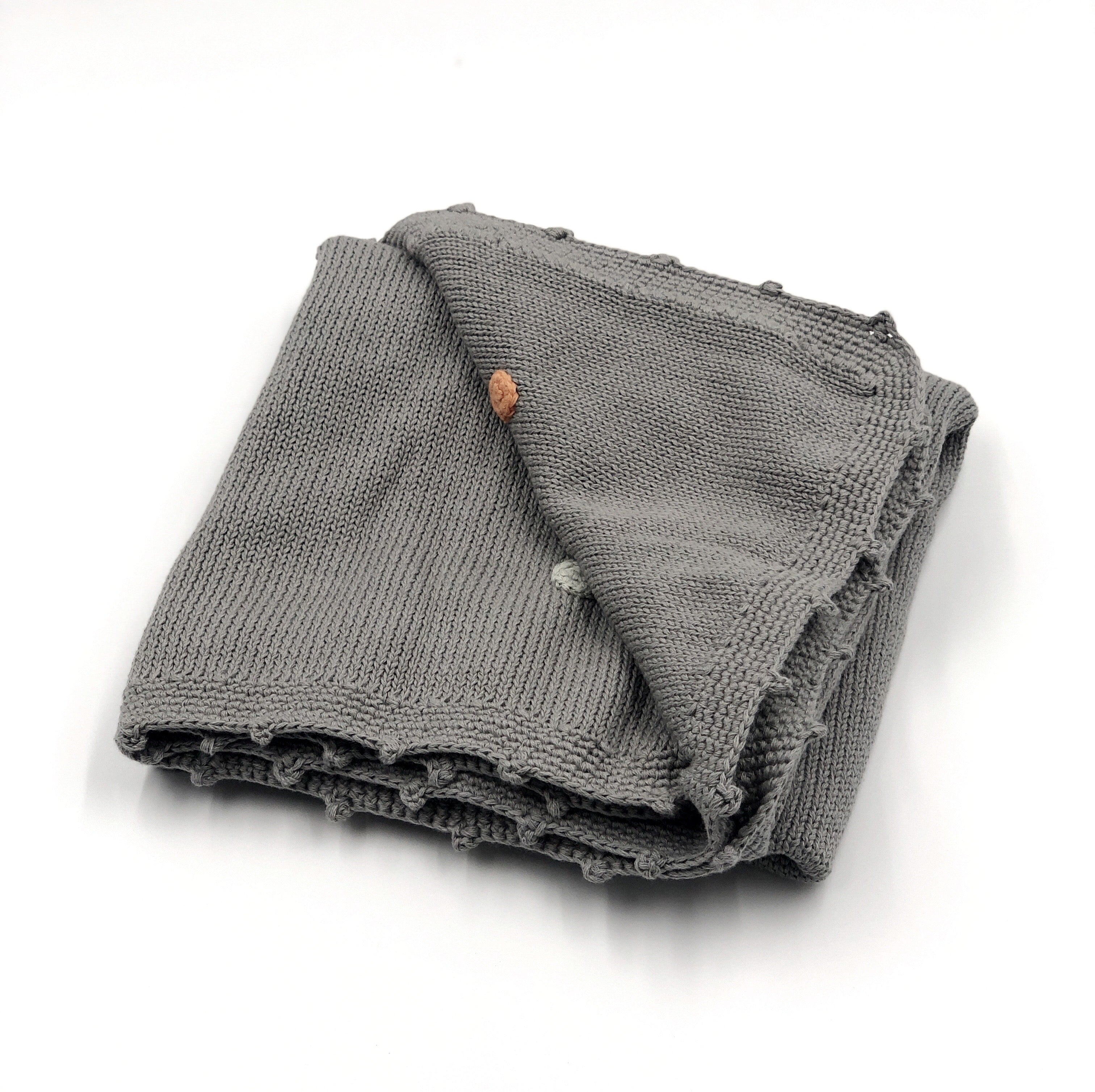 Organic-baby-blanket-gray-spotty-fold.jpg